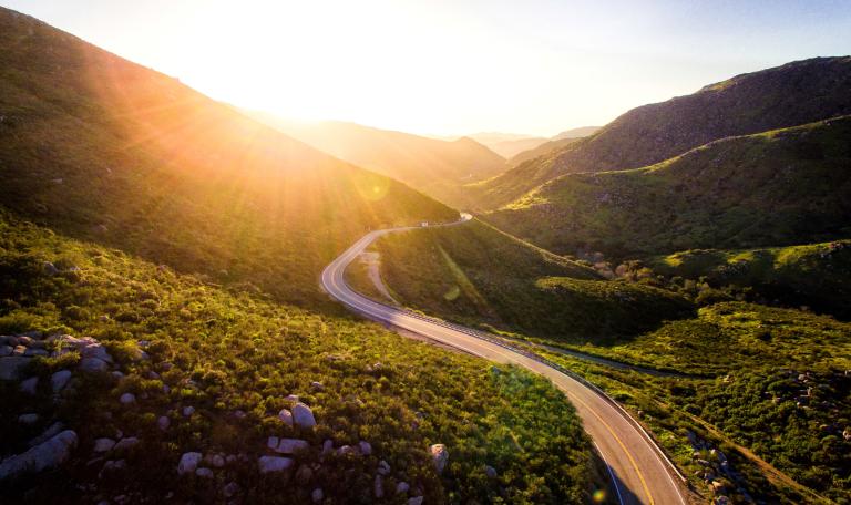 Image shows a winding road, symbolising a journey